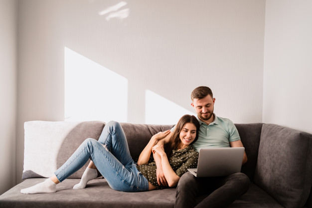 COUPLE SITTING ON A COUCH