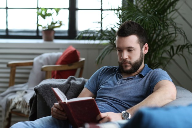 MAN READING A BOOK