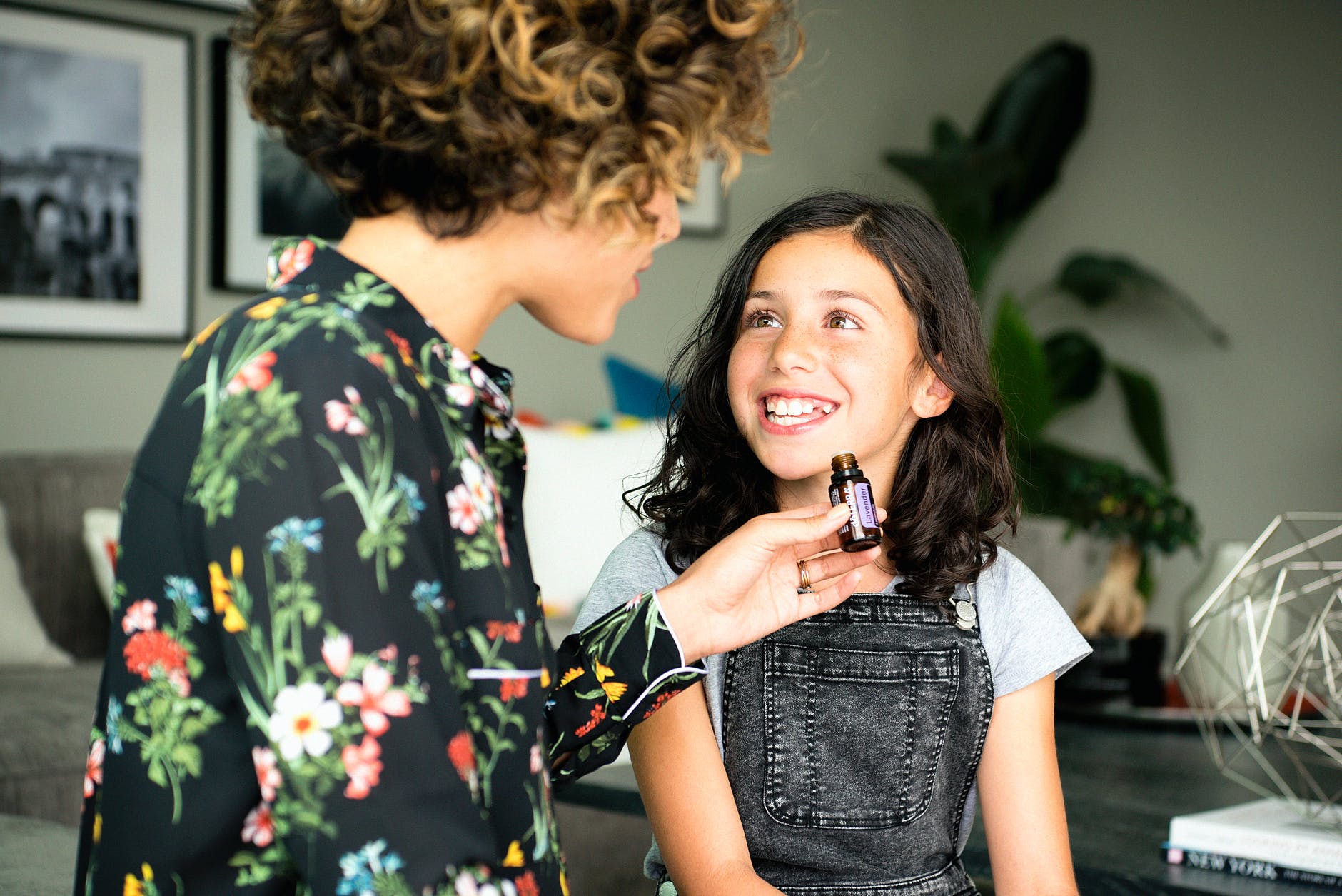 GIRL SMILES TO HER MOTHER